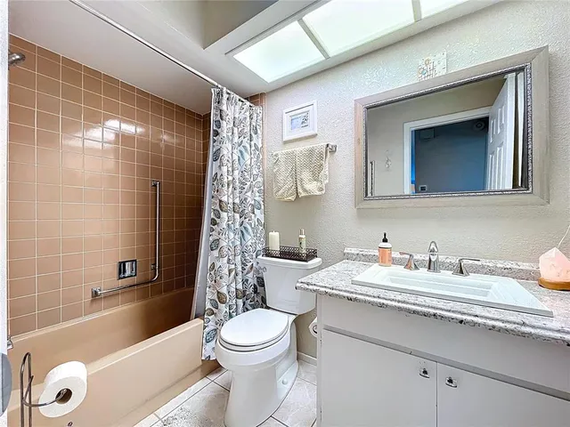a bathroom with a sink a toilet and a bathtub