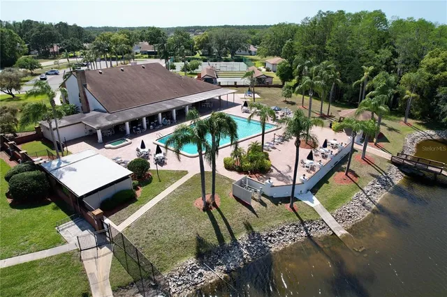 an aerial view of a house with garden space and street view
