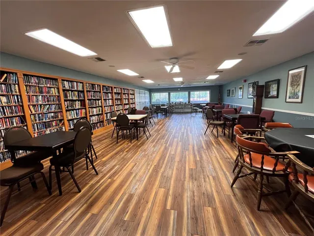 a living room with lots of furniture and a large window