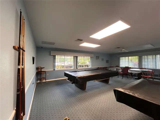 a living room with furniture a window and a table