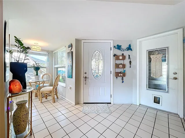 a view of a livingroom with furniture and front door