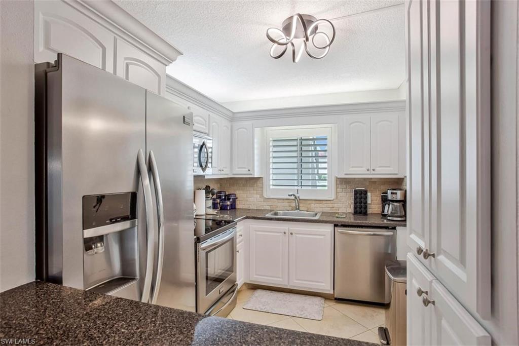 4318 27th Court Southwest, Unit 101 Naples, FL 34116 - Photo 14 of 19 all stainless steel appliances