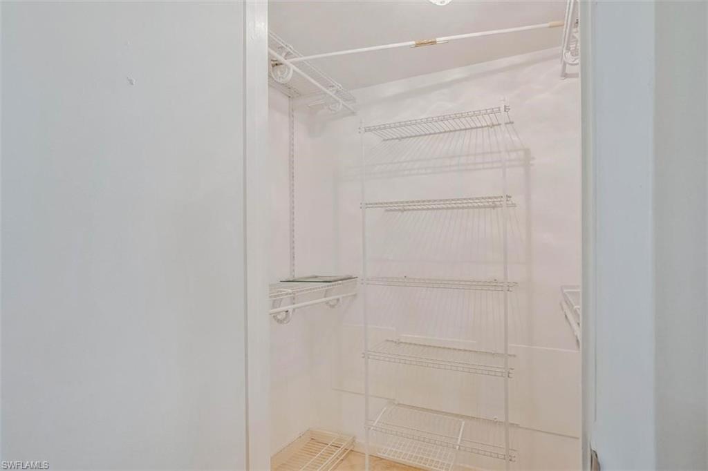 4318 27th Court Southwest, Unit 101 Naples, FL 34116 - Photo 16 of 19 large walk in closet in primary