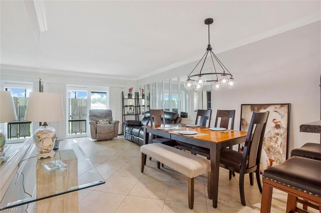 4318 27th Court Southwest, Unit 101 Naples, FL 34116 - Photo 5 of 19 table seats a crowd