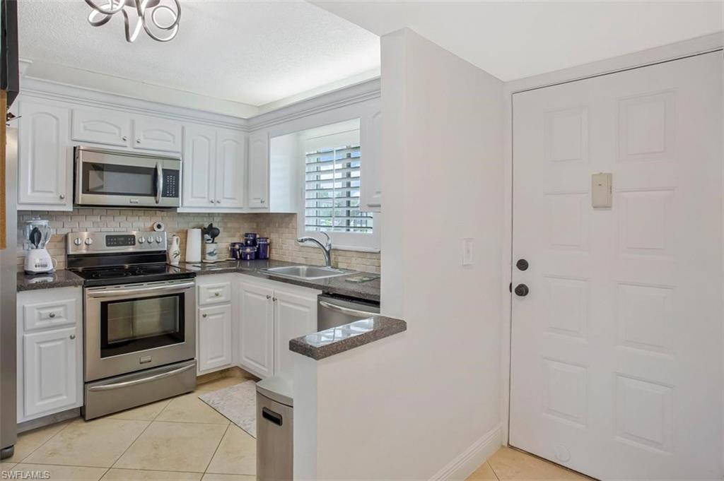 4318 27th Court Southwest, Unit 101 Naples, FL 34116 - Photo 8 of 19 opened wall make it bright and sunny
