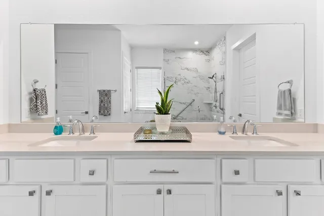 a bathroom with a shower and a bath tub