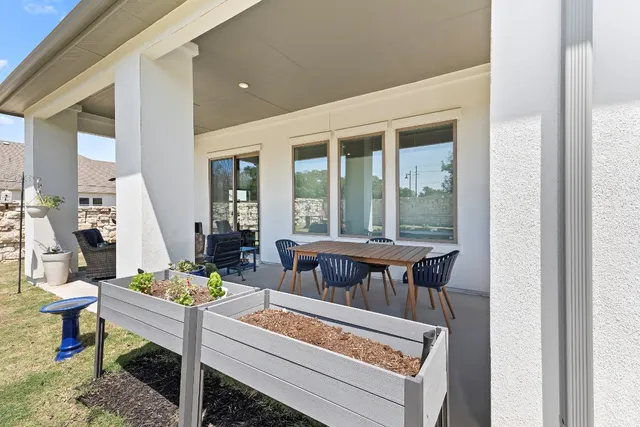 a view of a balcony with couch and wooden floor