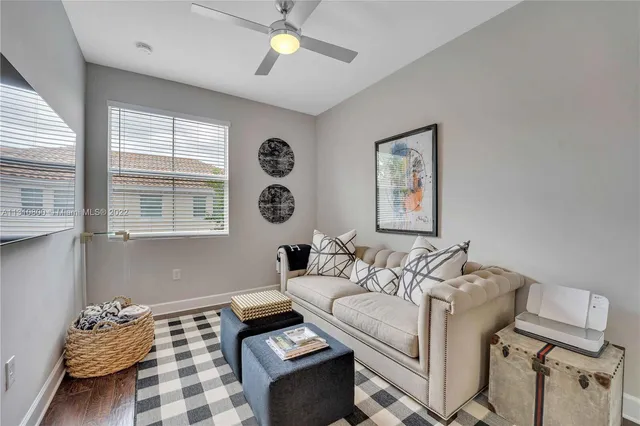 a living room with furniture and a window
