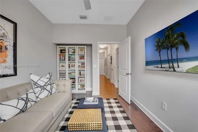 a living room with furniture and a rug