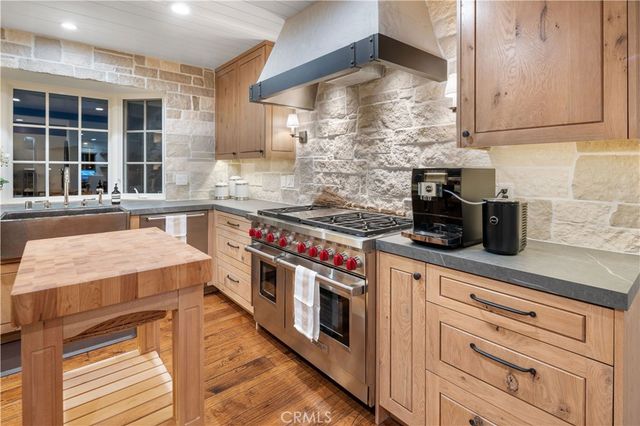 a kitchen with a stove and a sink