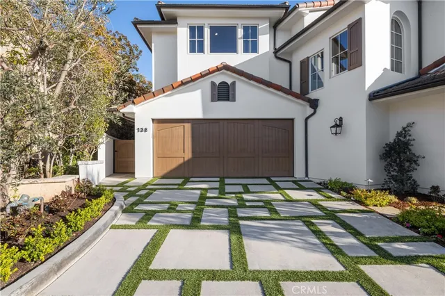 a view of a white apartments with large windows