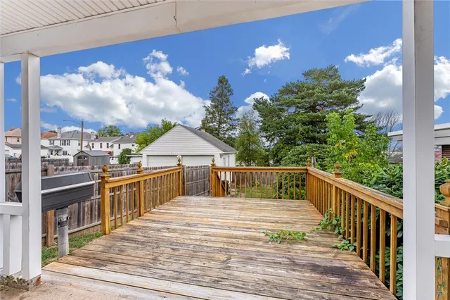 a view of a balcony with wooden floor