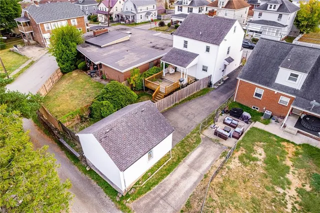 an aerial view of a house with a garden