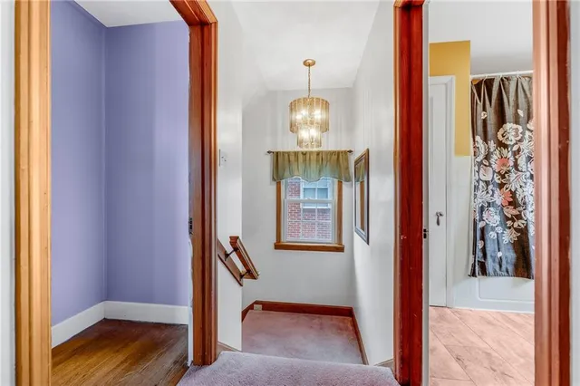 a view of an entryway with wooden floor