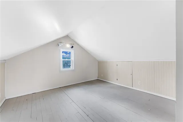 an empty room with a empty space and window