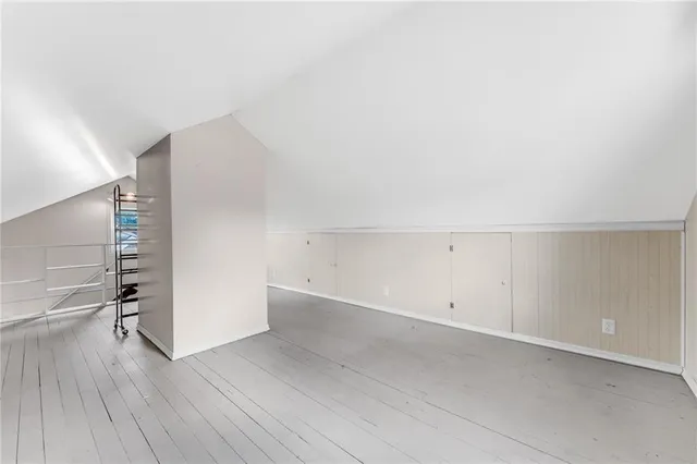 an empty room with wooden floor