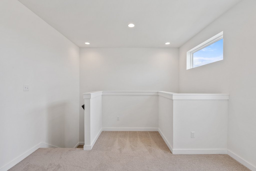 2205 Cento Walk Round Rock, TX 78664 - Photo 18 of 32 Unfurnished room with light colored carpet and recessed lighting