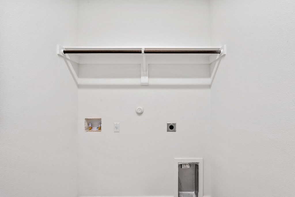 2205 Cento Walk Round Rock, TX 78664 - Photo 19 of 32 Laundry room with gas dryer hookup, hookup for a washing machine, and electric dryer hookup