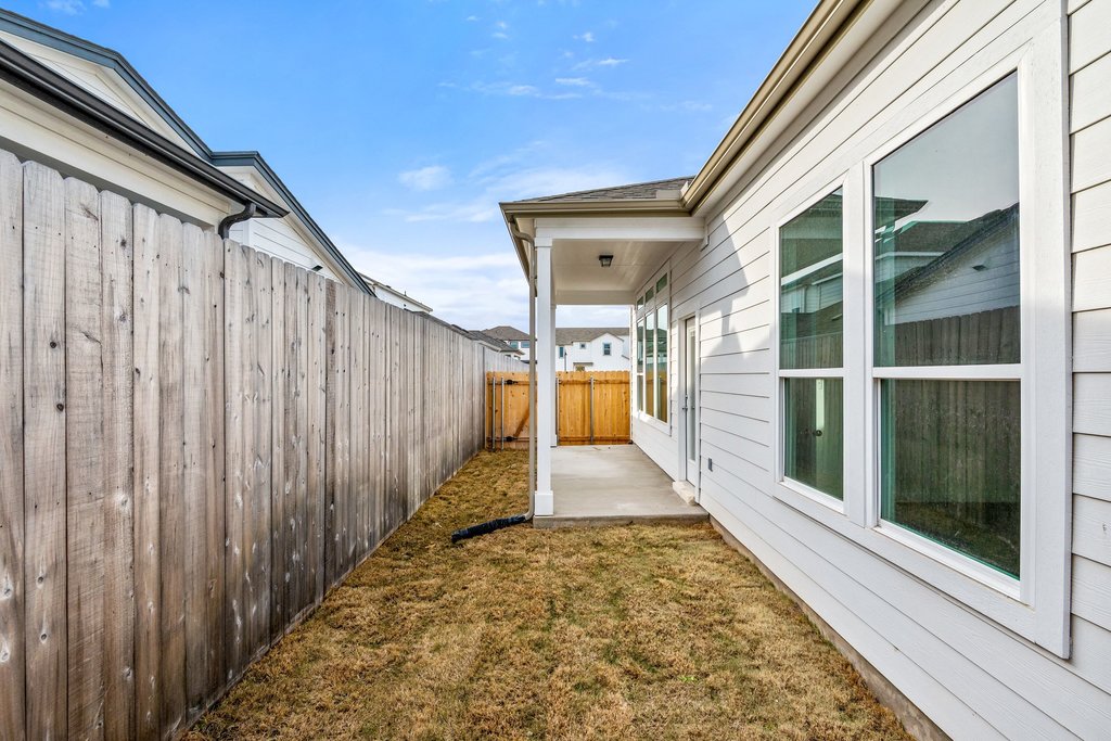2205 Cento Walk Round Rock, TX 78664 - Photo 24 of 32 Fenced backyard with a patio