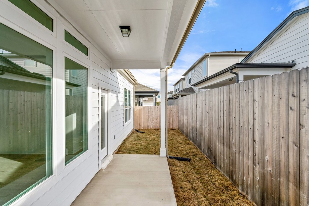 2205 Cento Walk Round Rock, TX 78664 - Photo 25 of 32 Fenced backyard with a patio