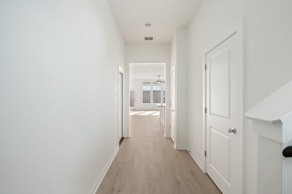 2205 Cento Walk Round Rock, TX 78664 - Photo 4 of 32 Hall with light wood-style floors and baseboards