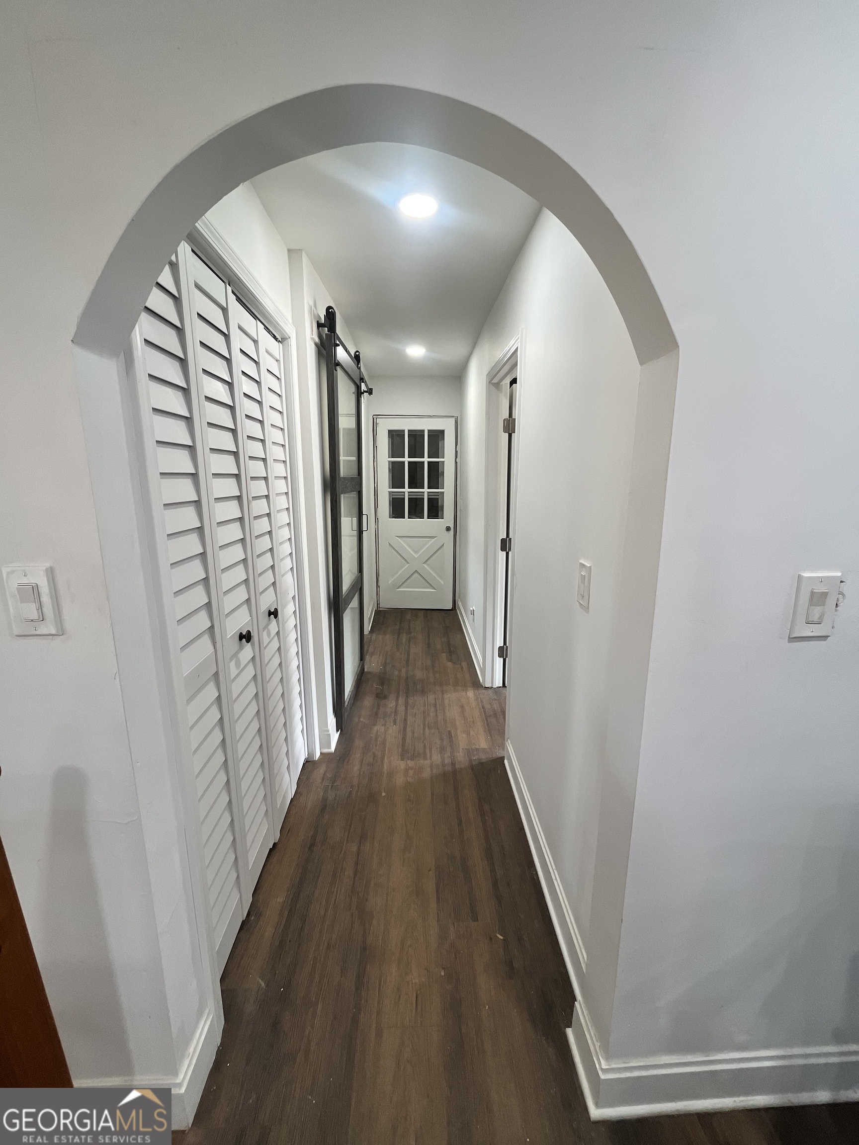 4360 Stonewall Tell Road College Park, GA 30349 - Photo 12 of 49 a view of a hallway with wooden floor and staircase