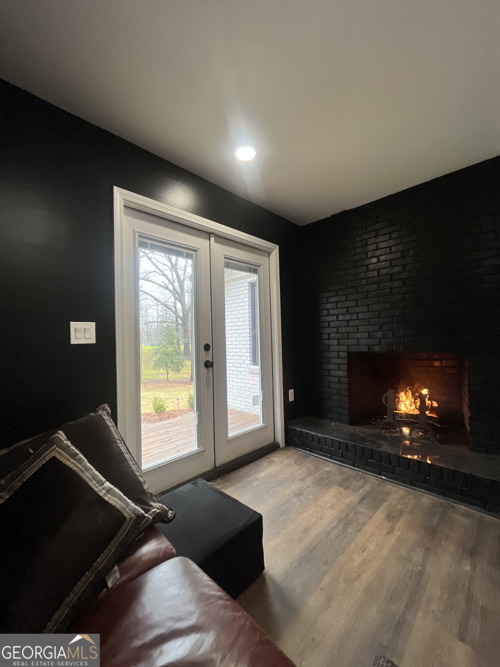 4360 Stonewall Tell Road College Park, GA 30349 - Photo 14 of 49 a view of an empty room with a fireplace