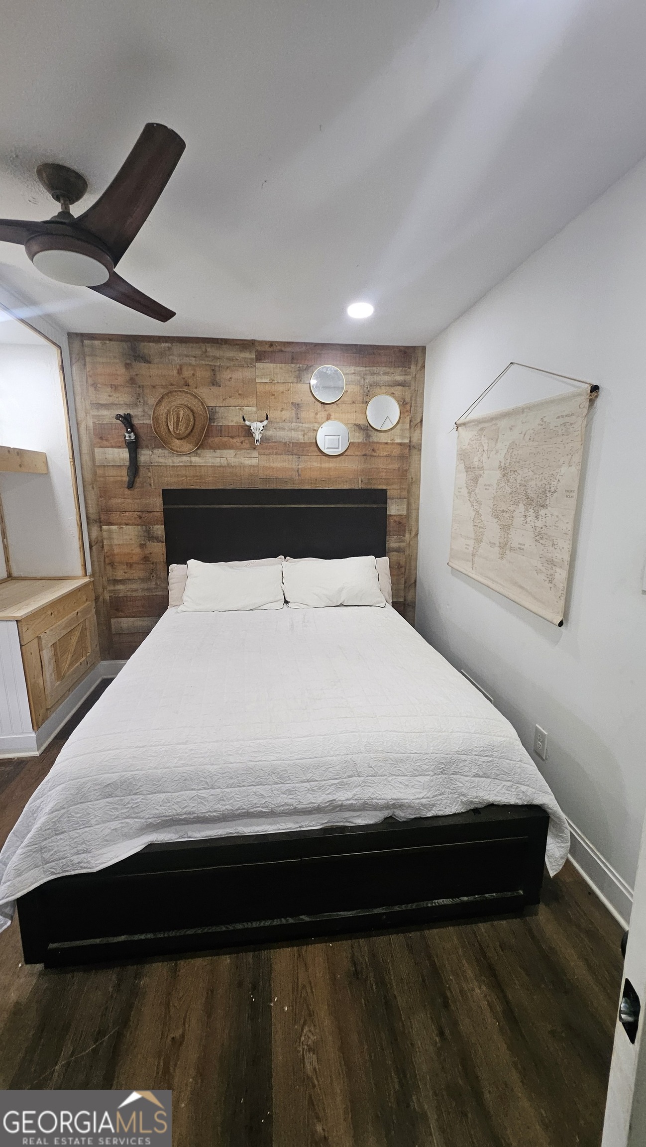 4360 Stonewall Tell Road College Park, GA 30349 - Photo 17 of 49 a large bed sitting in a room next to a lamp