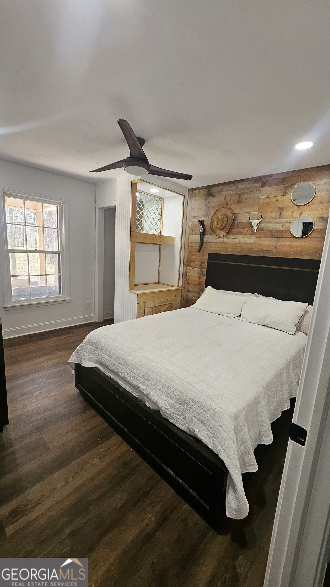 4360 Stonewall Tell Road College Park, GA 30349 - Photo 18 of 49 a bedroom with a bed and window