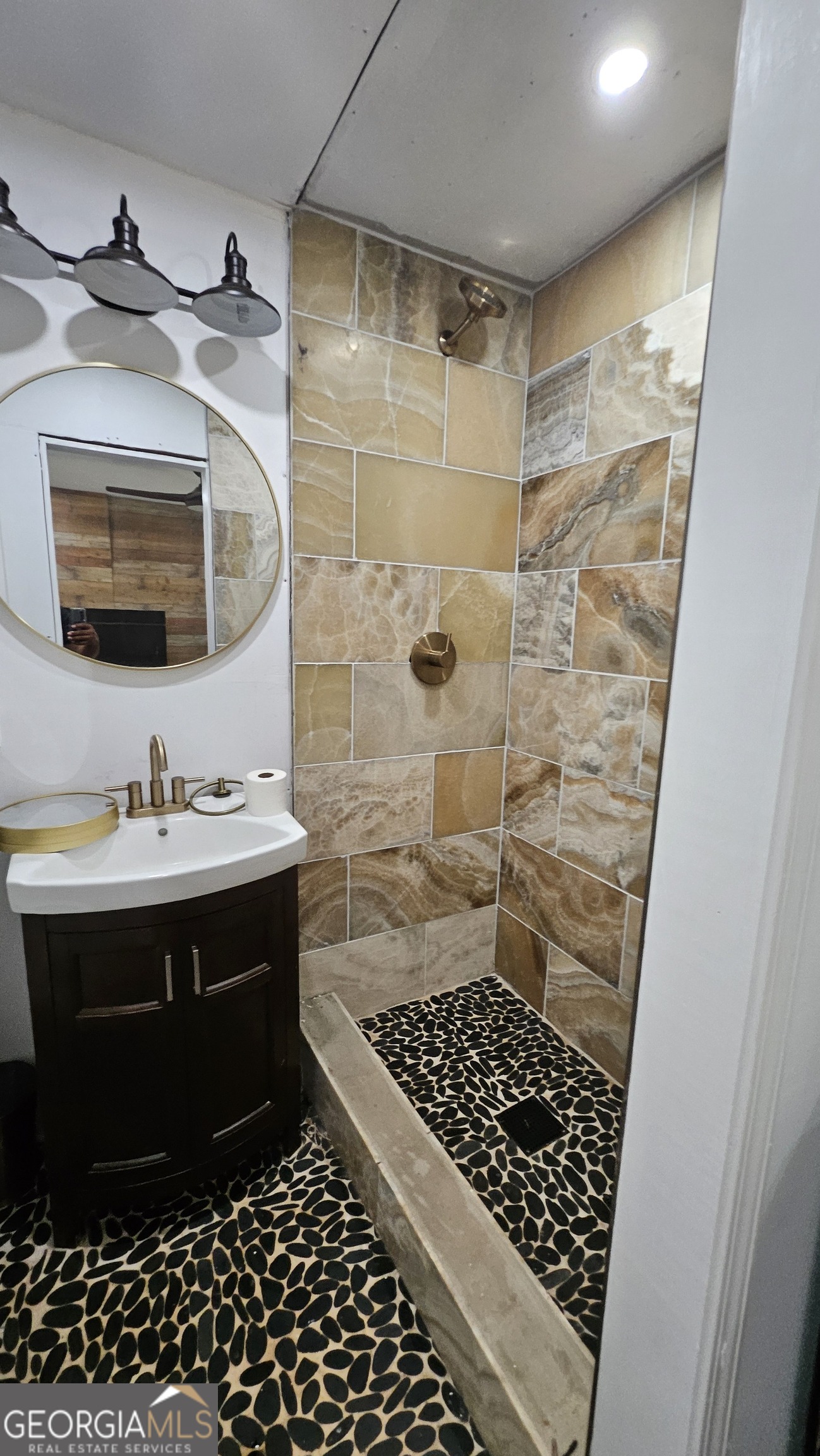 4360 Stonewall Tell Road College Park, GA 30349 - Photo 20 of 49 a bathroom with a sink and a shower