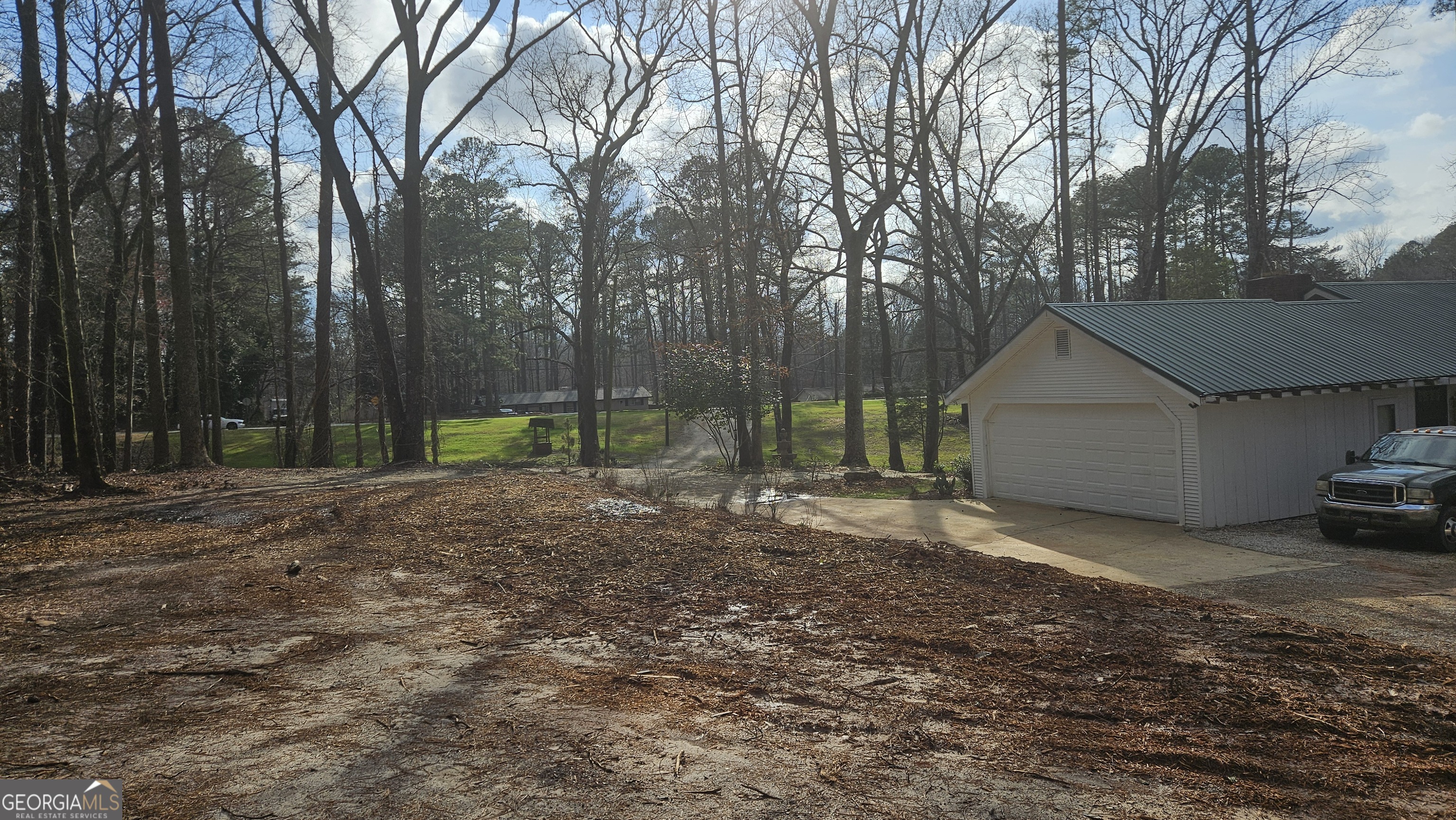 4360 Stonewall Tell Road College Park, GA 30349 - Photo 28 of 49 a view of a house with backyard and trees