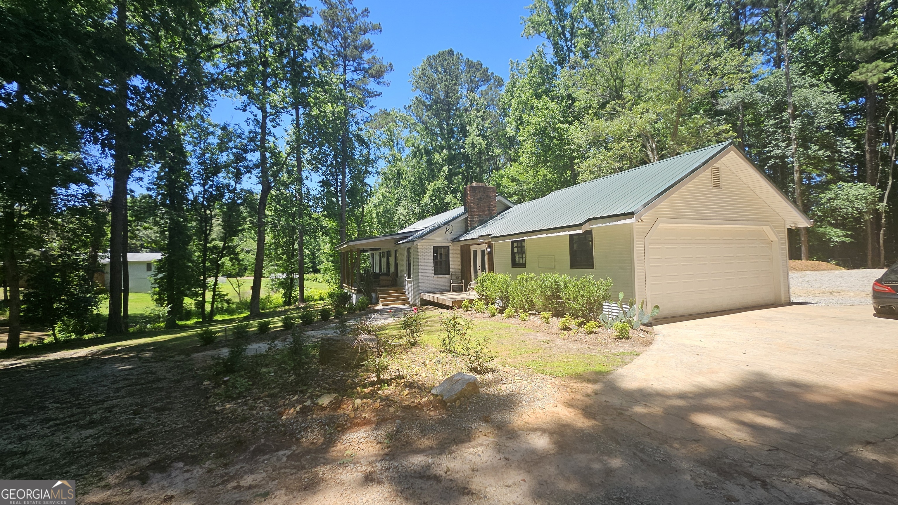 4360 Stonewall Tell Road College Park, GA 30349 - Photo 3 of 49 a front view of a house with a yard