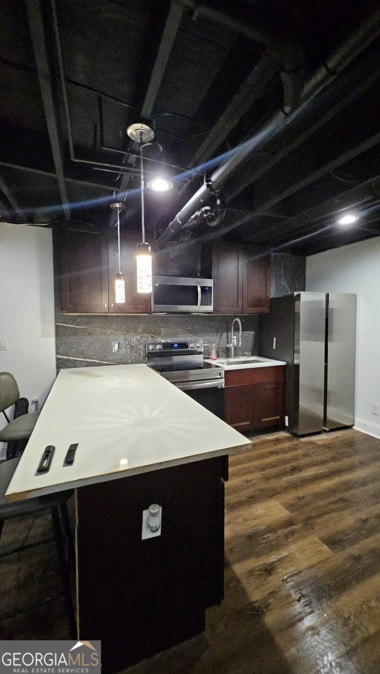 4360 Stonewall Tell Road College Park, GA 30349 - Photo 33 of 49 a view of an empty room with wooden floor