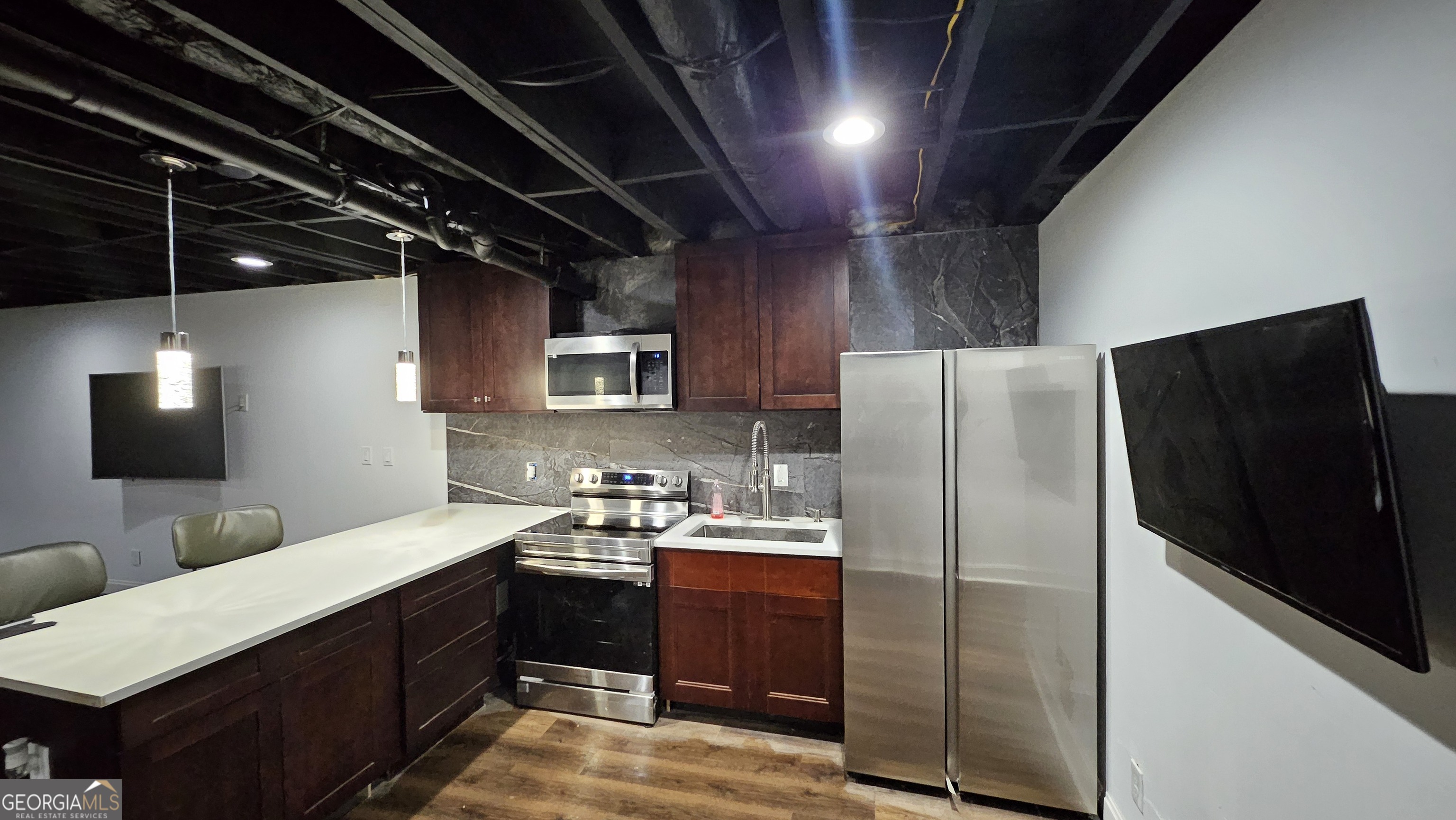 4360 Stonewall Tell Road College Park, GA 30349 - Photo 34 of 49 a kitchen with a refrigerator and a sink
