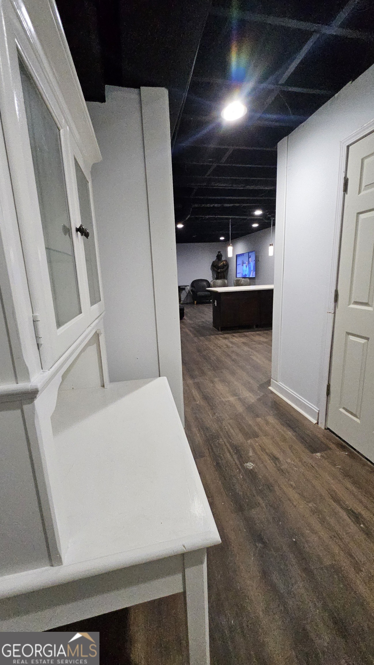 4360 Stonewall Tell Road College Park, GA 30349 - Photo 35 of 49 a view of an empty room with wooden floor