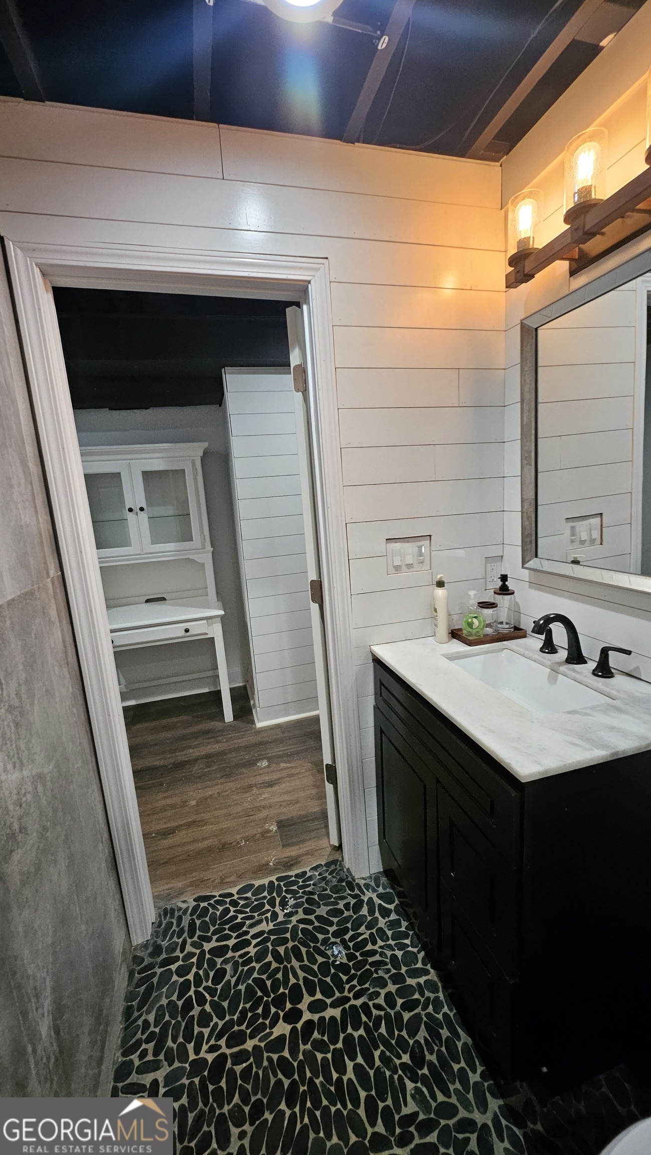 4360 Stonewall Tell Road College Park, GA 30349 - Photo 36 of 49 a bathroom with a sink and a mirror