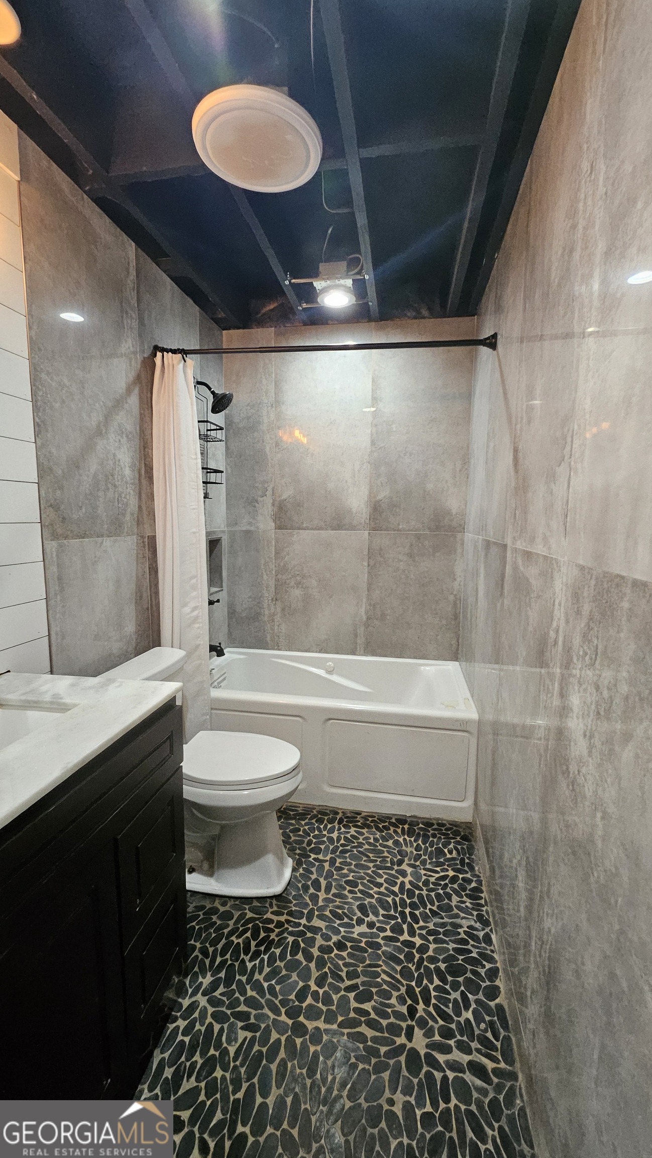 4360 Stonewall Tell Road College Park, GA 30349 - Photo 37 of 49 a bathroom with a toilet a sink and shower