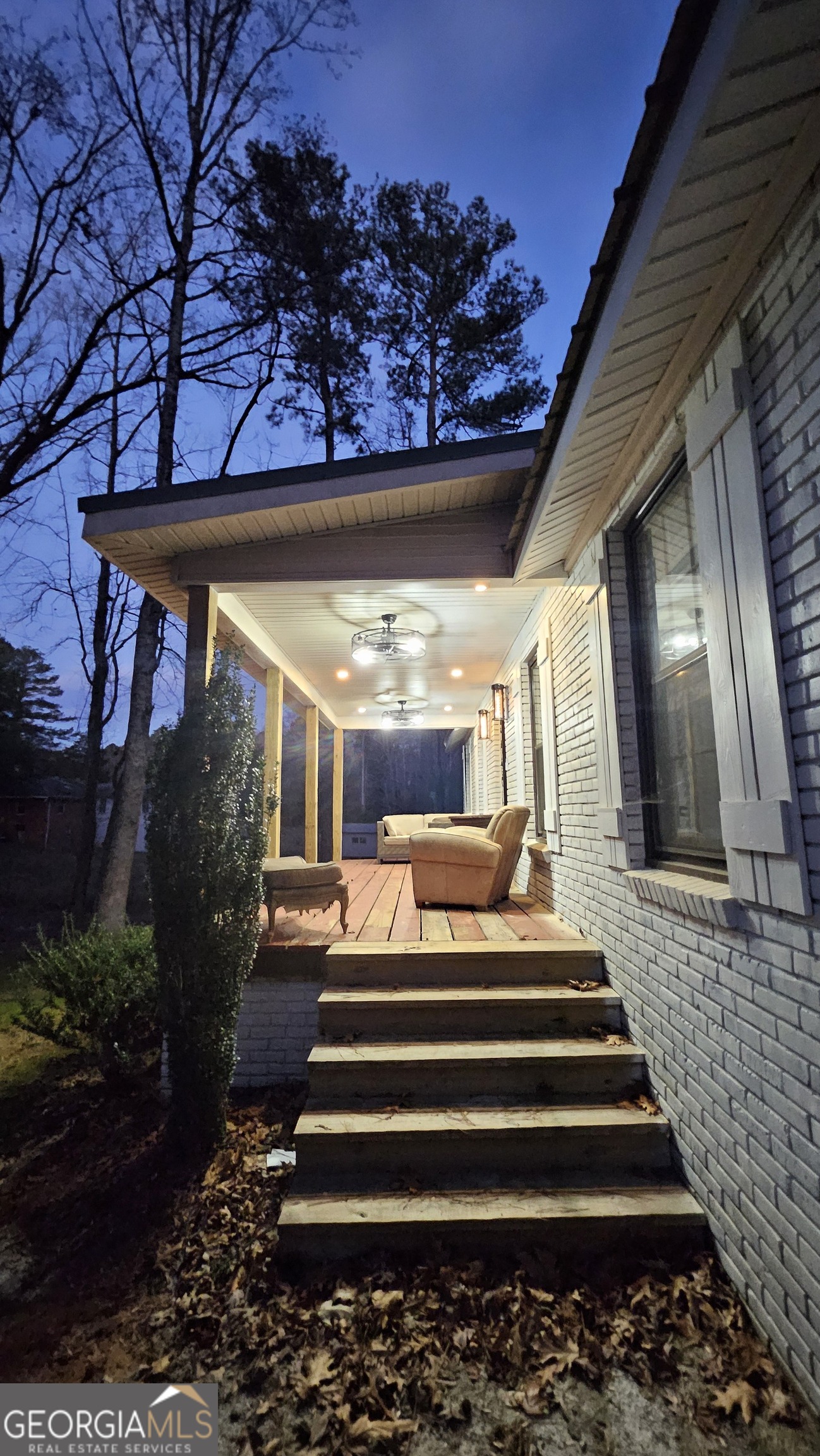 4360 Stonewall Tell Road College Park, GA 30349 - Photo 4 of 49 a view of a patio with a table and chairs