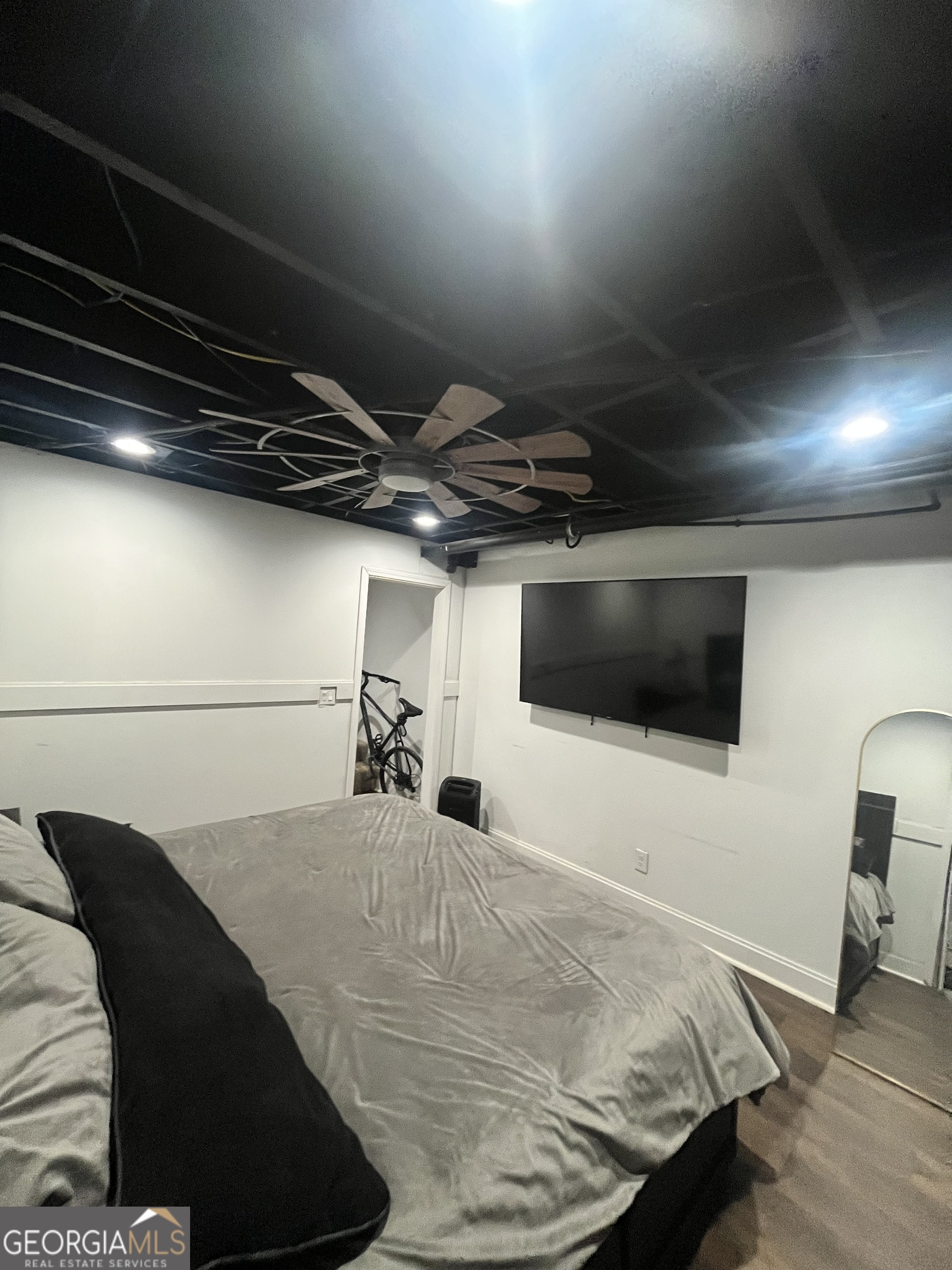 4360 Stonewall Tell Road College Park, GA 30349 - Photo 41 of 49 a bedroom with a bed and a flat screen tv