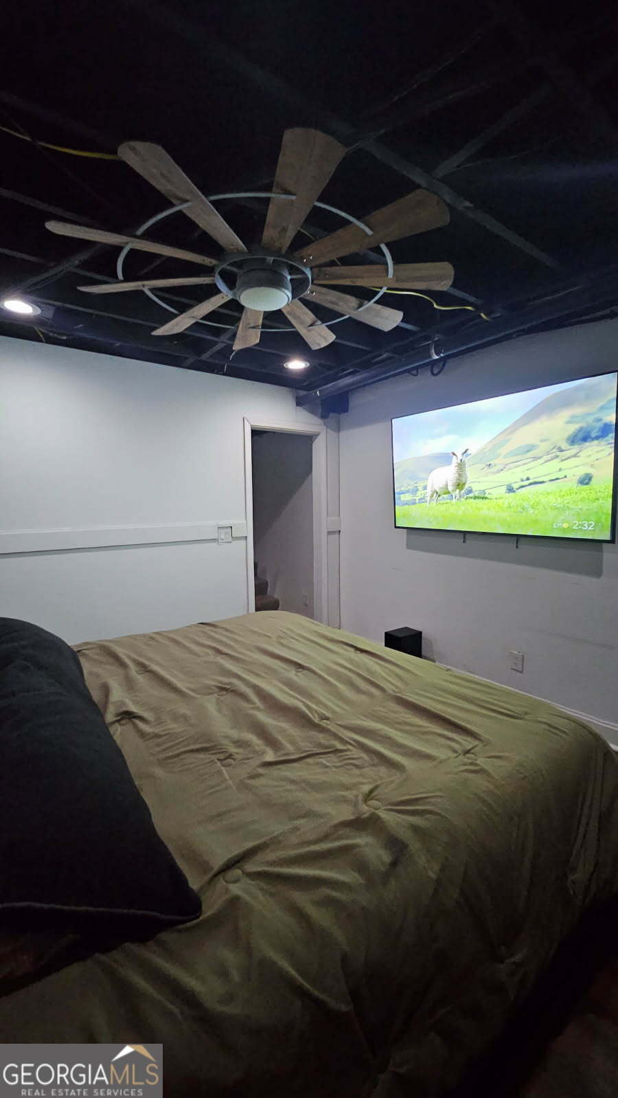 4360 Stonewall Tell Road College Park, GA 30349 - Photo 42 of 49 a bed sitting in a bedroom next to a window