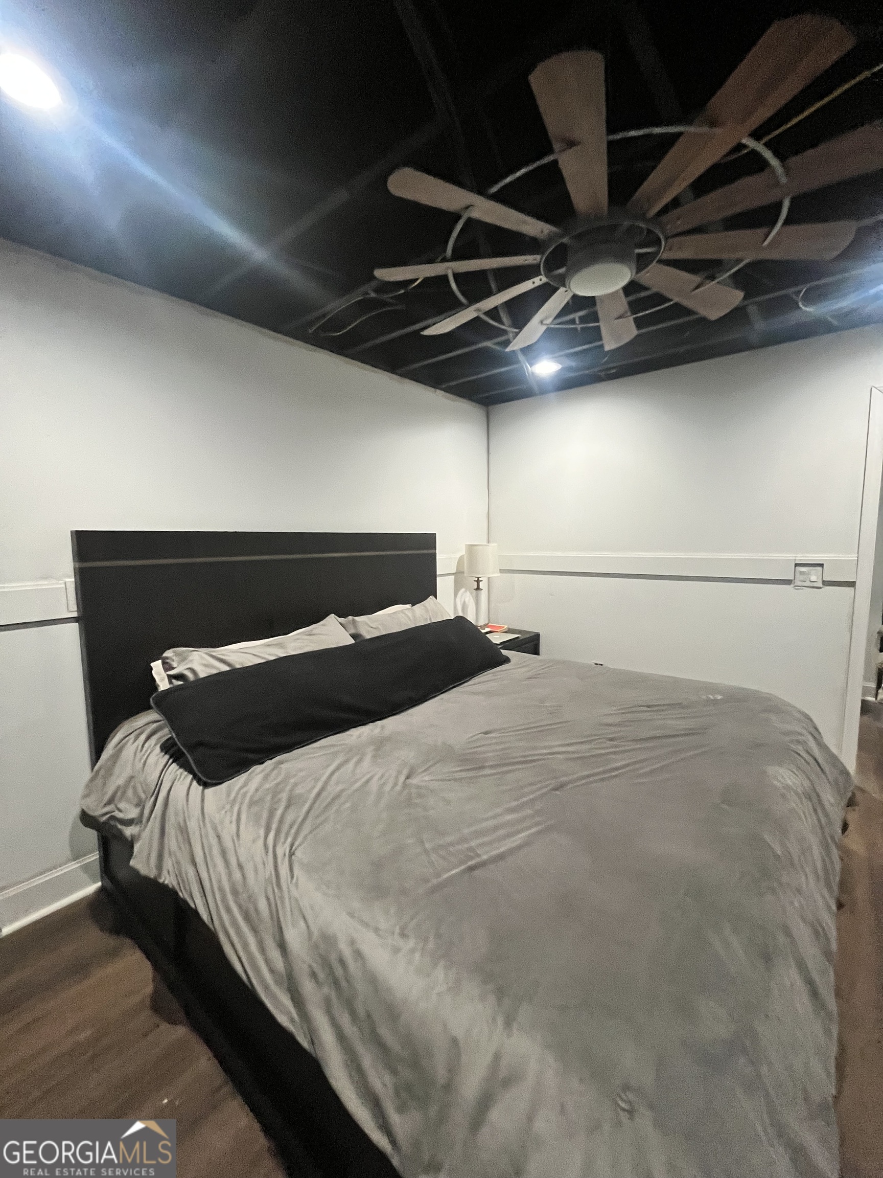 4360 Stonewall Tell Road College Park, GA 30349 - Photo 43 of 49 a bedroom with a bed and a walk in closet