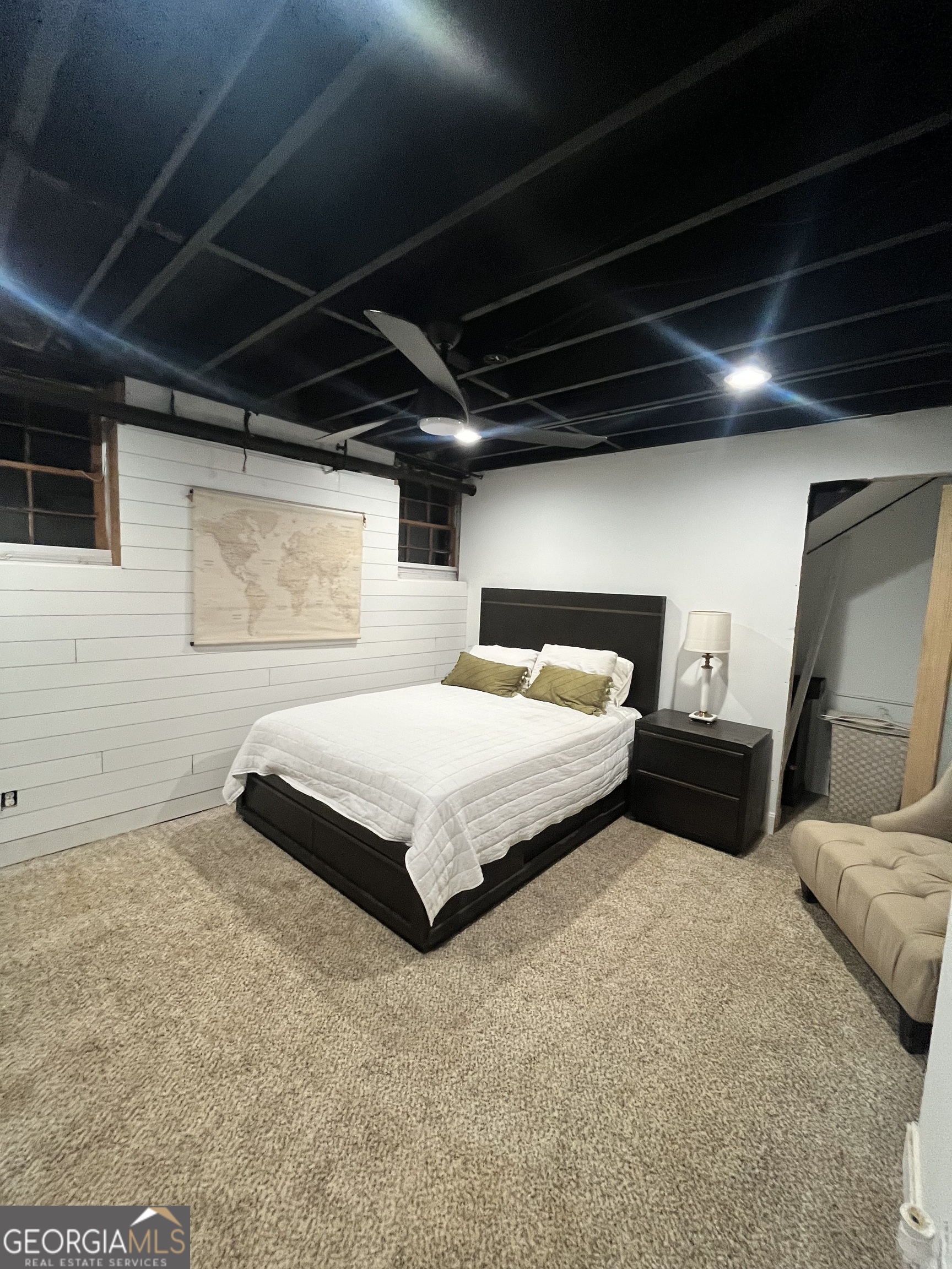 4360 Stonewall Tell Road College Park, GA 30349 - Photo 47 of 49 a bedroom with a bed and a couch