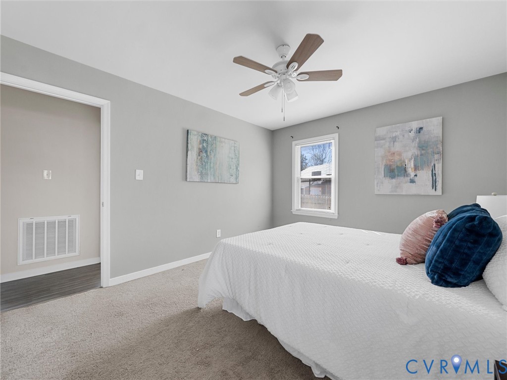 12206 Timber Trail Drive Midlothian, VA 23112 - Photo 21 of 40 a bedroom with a large bed and a window