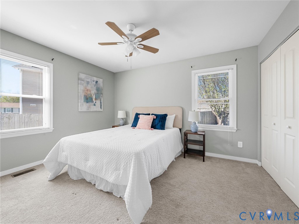 12206 Timber Trail Drive Midlothian, VA 23112 - Photo 23 of 40 a bedroom with a bed and a window