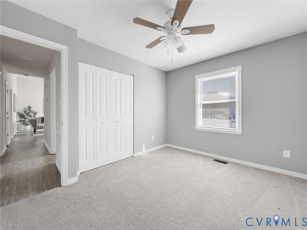 12206 Timber Trail Drive Midlothian, VA 23112 - Photo 26 of 40 an empty room with fan and windows