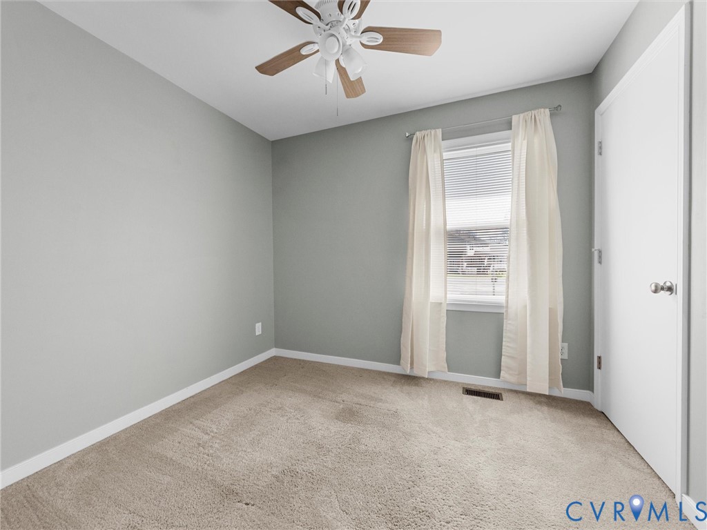 12206 Timber Trail Drive Midlothian, VA 23112 - Photo 28 of 40 an empty room with windows and fan