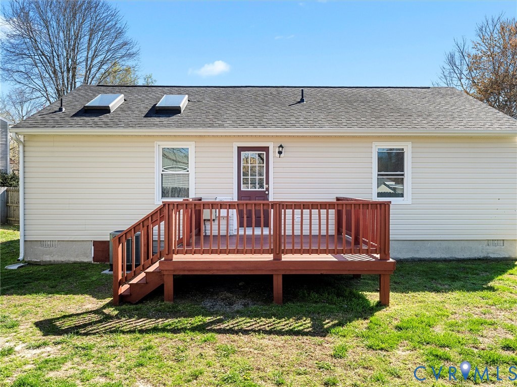 12206 Timber Trail Drive Midlothian, VA 23112 - Photo 32 of 40 a view of a house with wooden deck and a yard