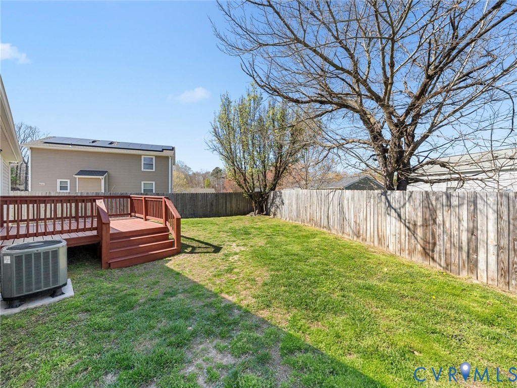 12206 Timber Trail Drive Midlothian, VA 23112 - Photo 34 of 40 a view of a yard with furniture and wooden fence