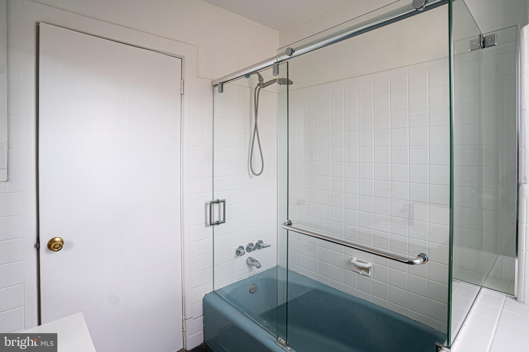 2540 East County Line Road Ardmore, PA 19003 - Photo 17 of 22 a bathroom with a shower and a toilet