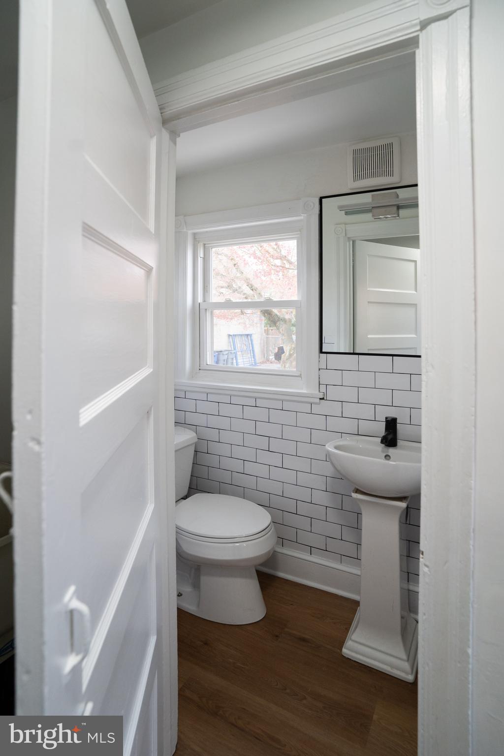 2540 East County Line Road Ardmore, PA 19003 - Photo 19 of 22 a bathroom with a toilet and a sink
